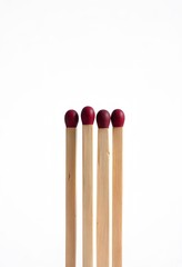 Naklejka premium Isolated red tipped matchsticks on white background fire safety concept art