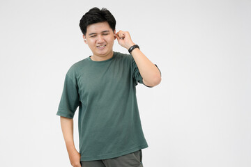 young asian man enjoying music with earbuds in white background
