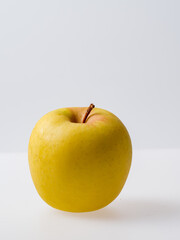 delicious yellow apple on a white background