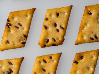 The family is sitting at home on the mats