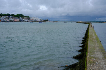 A view of Cowes, Isle of Wight, from across the shore on typical moody and rainy day.