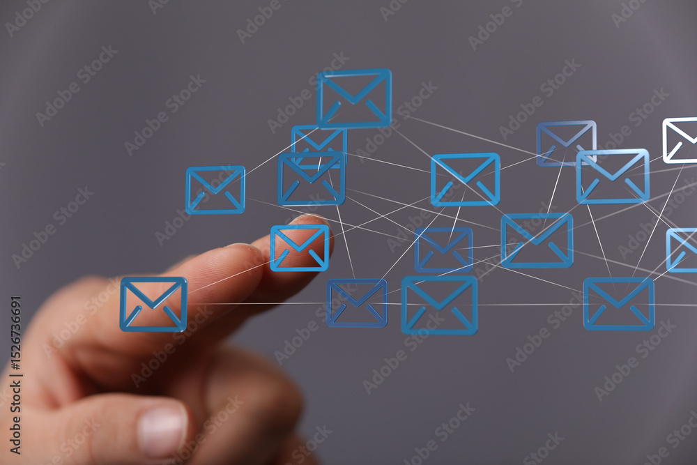 Aufkleber Hand interacting with digital email icons, representing global communication and networking.