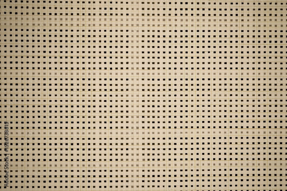 Poster patterns in a woven fabric showcasing a neutral color palette with contrasting squares and rectangle