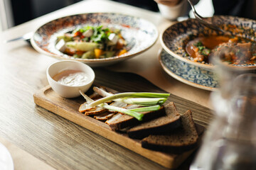 Fresh rye bread with lard, green onions, Ukrainian dish for borscht.