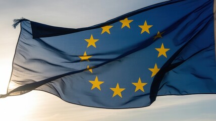 European union flag waving against sunset sky