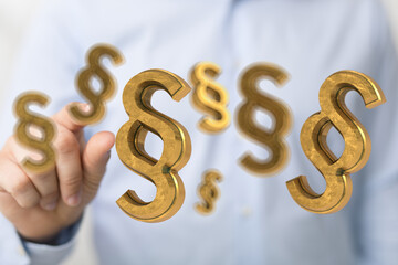 Abstract image of golden paragraph symbols floating, ideal for legal and justice concepts.