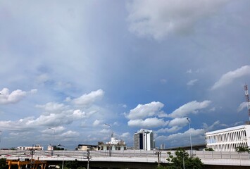Daytime Dhaka Sky with Clouds Over Cityscape and Overpass