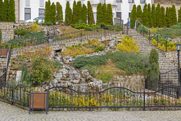 Waterfalls Stream in Hill Garden With Stones at Spring Day