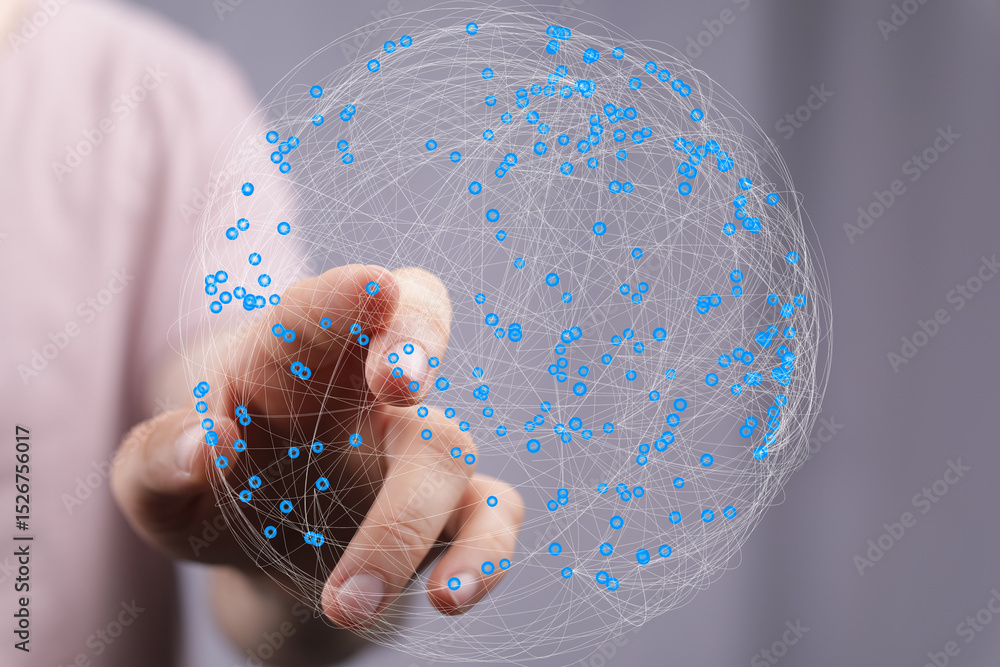 Leinwandbilder Abstract image of a hand interacting with a digital sphere representing global networking and connection.