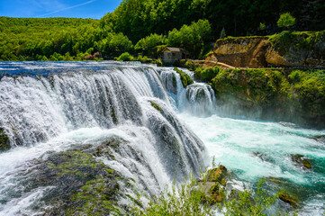 Amazing Strbacki buk waterfalls on river Una in Bosnia and Herzegovina. Beautiful nature in Una national park with crystal clear water and amazing cascade waterfalls.