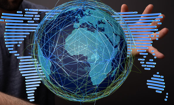 Hand interacting with a digital globe, illustrating global connectivity and data exchange. - Powered by Adobe