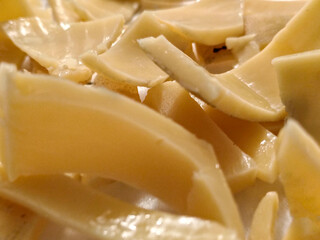 Close-up of uncooked yellow pasta curls