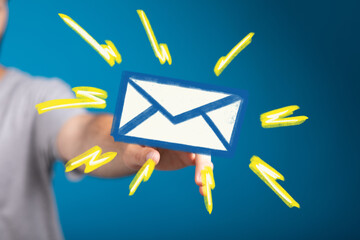 A hand holding a vibrant email icon, symbolizing fast and efficient communication.