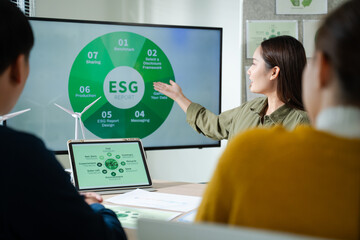 Young Asian business team discussion reusable product in office,start up eco-friendly business,environmental protection,sustainable business model,ESG strategy,team meeting,people work at home concept