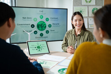 Young Asian business team discussion reusable product in office,start up eco-friendly business,environmental protection,sustainable business model,ESG strategy,team meeting,people work at home concept