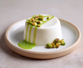 Pistachio drizzle panna cotta with nuts