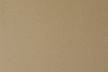 High-resolution image of a beige cardboard texture, perfect for backgrounds or design projects.