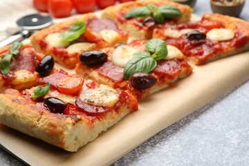 Tasty homemade pizza on grey table, closeup