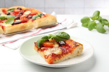 Tasty homemade pizza on white wooden table, closeup