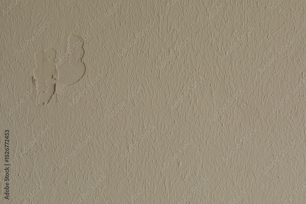 Poster High-resolution image of a beige wall with textured plaster showing damage. Ideal for backgrounds and design projects.