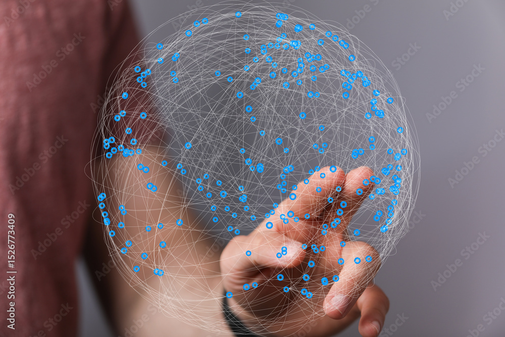 Poster Person interacting with a digital globe, representing global networking, connectivity, and data visualization.