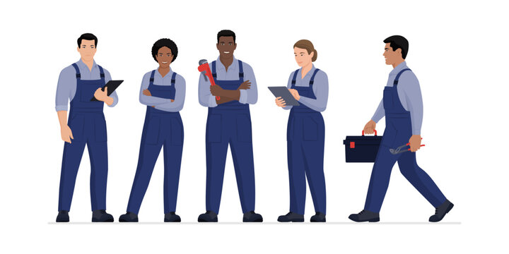 Professional plumbers and engineers standing together