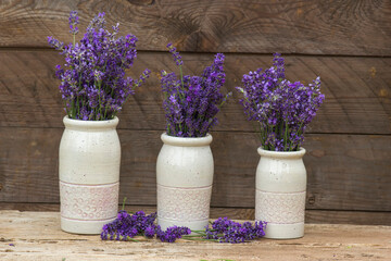 lavender flowers in white vases