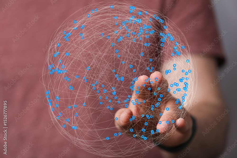 Fototapete Abstract image of a hand interacting with a digital globe, representing global networking and connection.