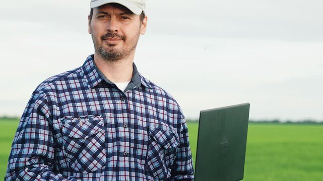 portrait senior agricultural technician wheat field, agriculture, green wheat plantation, farmer agronomist with laptop works wheat field, industry ecology business, worker field, agricultural