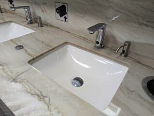 Ceramic washbasins, mirrors in the public toilet at Istanbul Airport