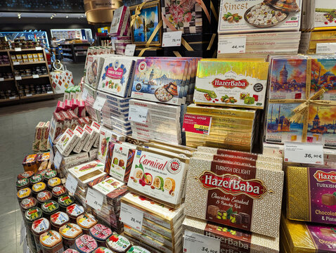 Turkey, Istanbul - 04.29. 2025: Various Turkish souvenirs, sweets, delicacies, candies, halva in beautiful packages on the counter in a duty free shop in Istanbul