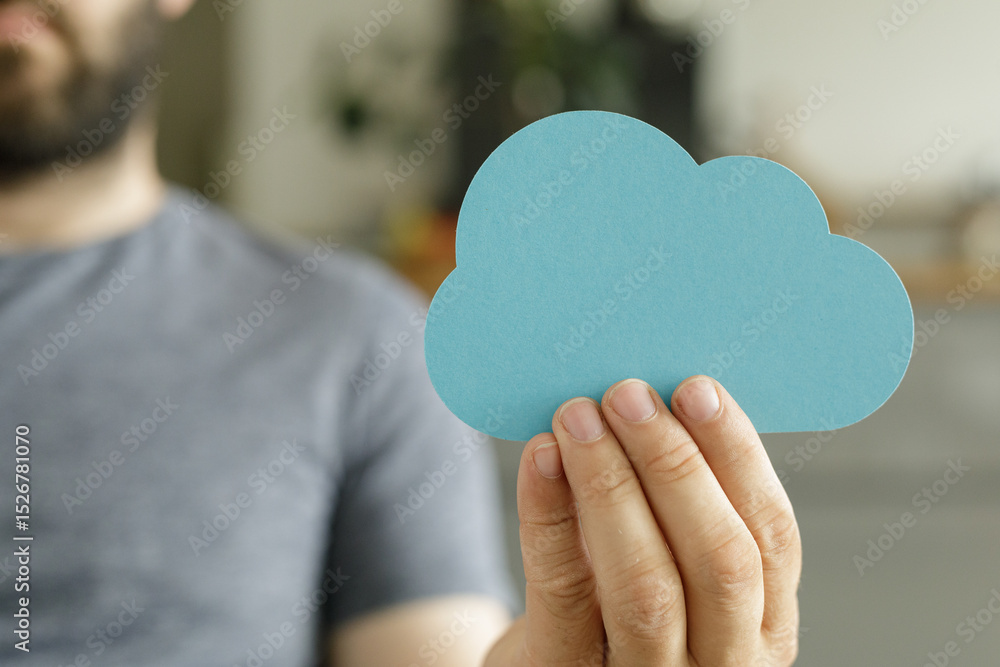 Poster image of a person holding a paper cloud, symbolizing cloud computing, storage, and data.