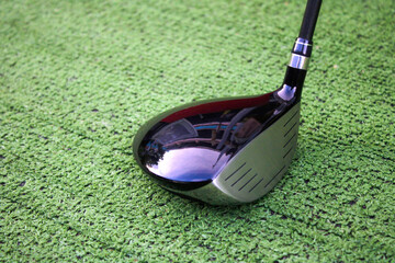 Close-Up of a Golf Driver on Artificial Grass for Sports Enthusiasts