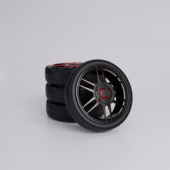 Set of four black and red car wheels with sport rims isolated on white background – 3D rendering