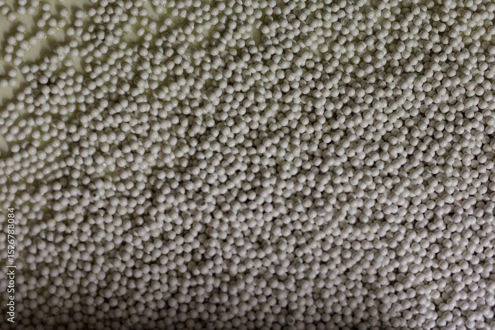 Poster high-resolution stock photo of a dense collection of small, white beads. perfect for backgrounds or 
