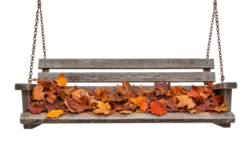 Autumn leaves rest on a rustic wooden swing hanging from chains against a muted transparent background. background removed