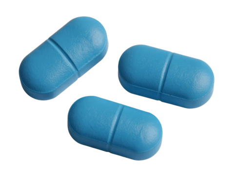 Vibrant blue medication capsules on a clean surface ready for patient use during a healthcare routine in daylight