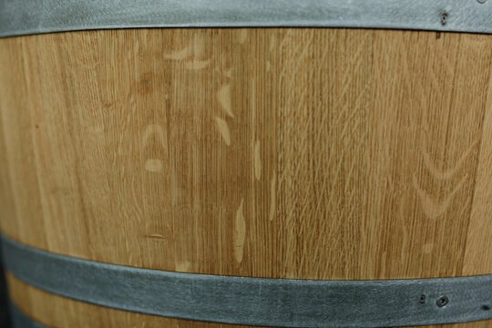 High-resolution image of oak wood barrel texture, perfect for rustic backgrounds and designs.