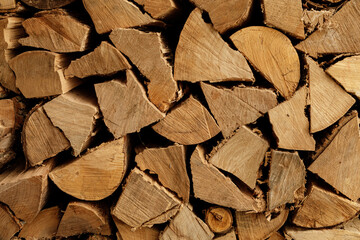 Close-up of neatly stacked firewood logs, perfect for winter warmth and cozy ambiance.