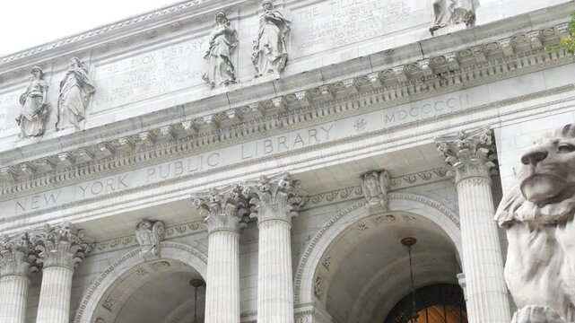 New York City, Manhattan Midtown Bryant Park. Public library building architecture, 42 street and 5th Fifth 5 avenue corner, United States. NYC landmark in USA. Facade exterior and lion sculpture