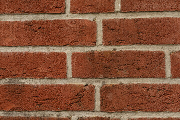 High-resolution image of a red brick wall, perfect for backgrounds or textures.  Ideal for construction, design, and architecture projects.