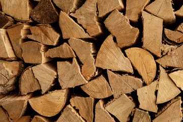 High-quality image of neatly stacked firewood, perfect for websites or blogs about winter,...