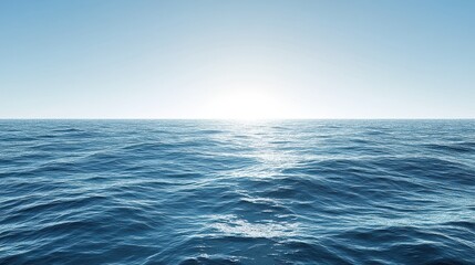 Fototapeta premium A stunning panoramic view of the ocean with gentle waves under a clear blue sky, capturing the serene beauty of nature and the vastness of the sea.