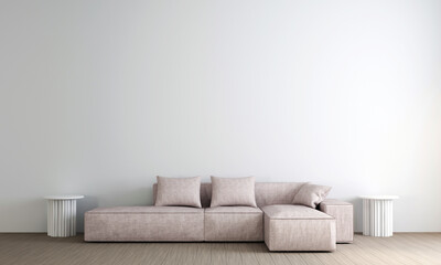 A living room with a couch and two tables by a white wall