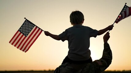 Patriotic sunset silhouette of boy on soldier's shoulders. Young boy waving American flags on military parent at dusk. Emotional family moment with flags against sunset sky. - Powered by Adobe