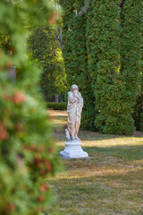 Aged Stone Statue in Secluded Park Nook