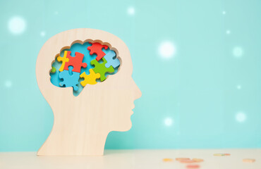 Human Brain Profile Made of Colorful Puzzle Pieces - Wooden Silhouette with Mental Activity Representation for Brain Health Awareness, Neurology Education, and World Brain Day Campaigns