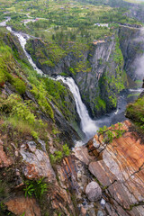 Majestic waterfall of Vøringfossen in a foggy day (Norway)