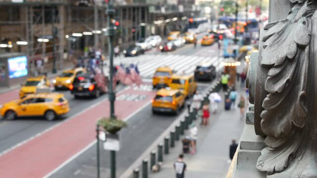 New York City Grand Central Terminal railway station, 42 street. Manhattan Midtown. Yellow taxi cab row, car transport and Pershing Square bridge, NYC, USA. American road traffic, people pedestrians.