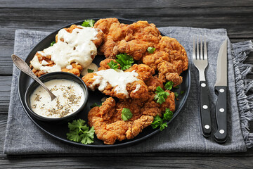 Deep fried Southern chicken thighs with milk gravy